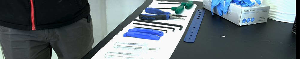 Parktools on a bench with blue nitrile gloves
